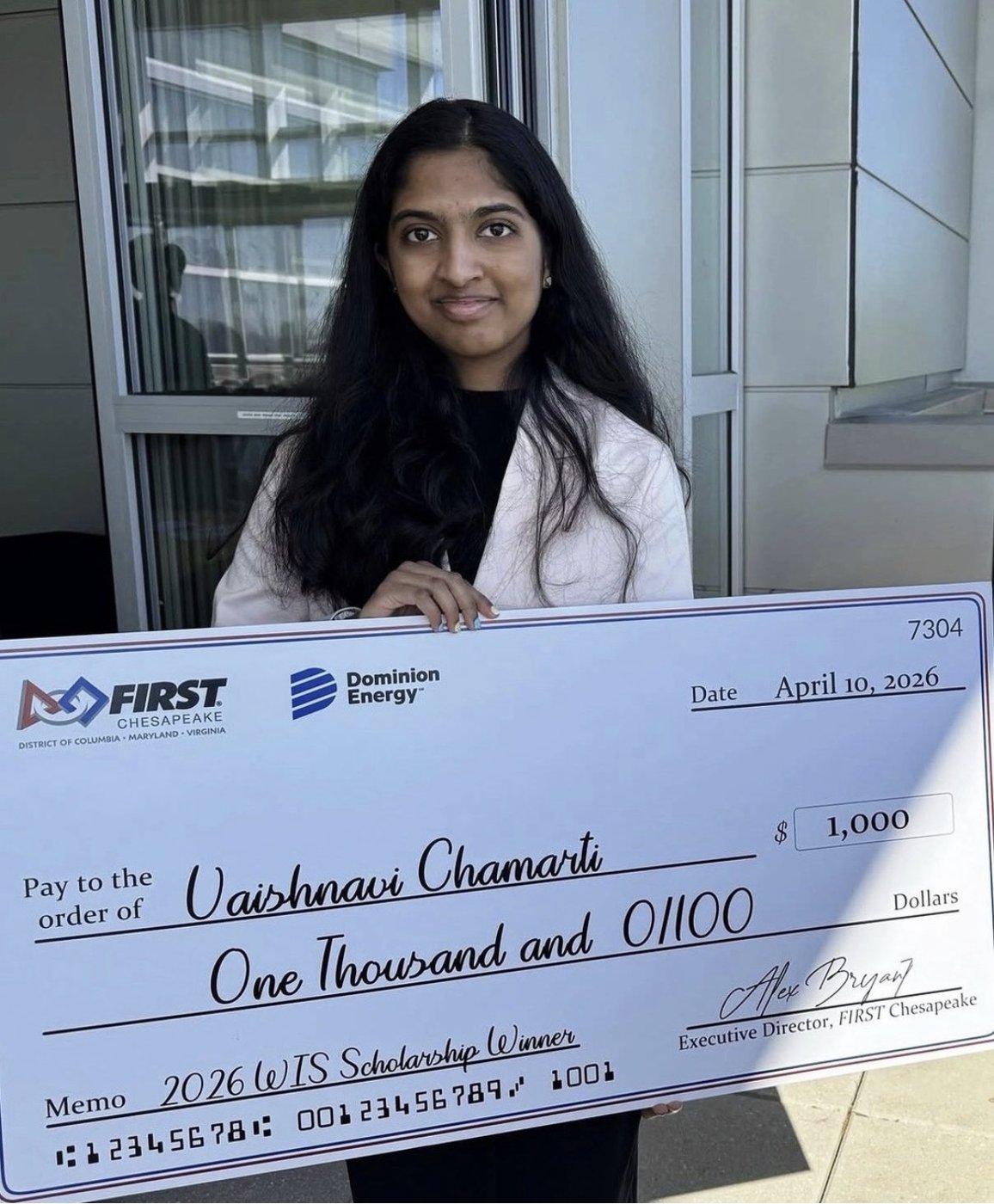 Vaishnavi holding FIRST Chesapeake Women in STEM Scholarship award check